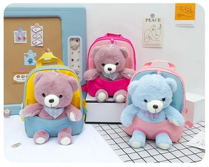Detailed view of three cute bear backpacks in pink and blue for kids nursery