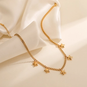 Elegant 18K gold-plated stainless steel necklace with five star pendants on silk background
