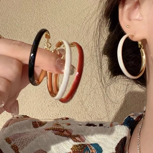 Retro style enamel round hoop earrings for women in black white and red color options