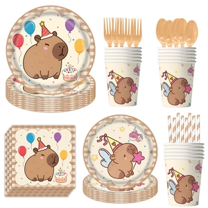 Detailed set of Capybara themed party plates, cups, napkins and golden cutlery on white