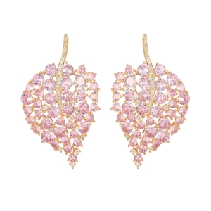 Elegant gold-tone leaf earrings with pink cubic zirconia and white crystal accents