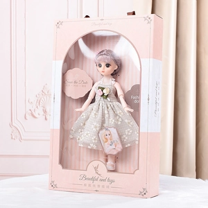 Elegant princess doll with lilac hair in floral dress, showcased in a pink window gift box