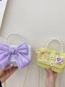 Kids tweed crossbody bags with pearl handles and stylish bows in purple and yellow