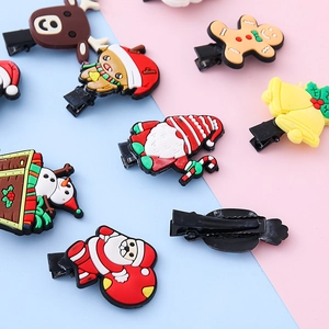 Christmas hair clip set featuring Santa, reindeer, and snowman soft rubber motifs