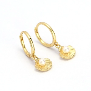 Elegant gold shell hoop earrings with white pearls, minimalist marine style jewelry