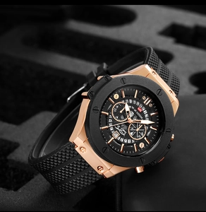 Detailed close-up of a waterproof chronograph watch with rose gold case and rubber strap
