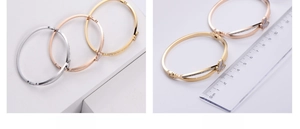 Detailed scale measurement of butterfly charms on titanium steel bangles with shell inlay