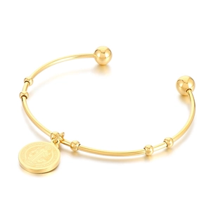 18K gold plated stainless steel open bangle featuring a Saint Benedict medal charm