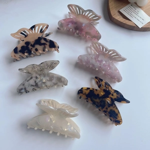 Selection of acetate butterfly hair claws in marble and tortoiseshell patterns