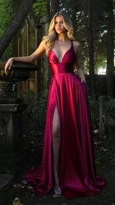 Detailed view of magenta satin floor-length dress with a high slit and deep V-neckline