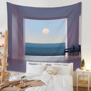 Detail showing the surreal ocean and moon pattern on a bohemian hanging wall tapestry