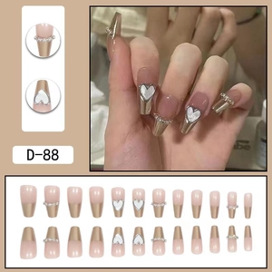 Translucent brown press-on nails with silver metallic lines and 3D heart rhinestones