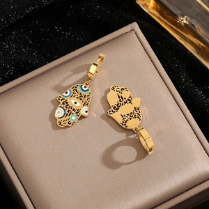 Golden titanium steel Hamsa Hand earrings with blue enamel leopard pattern and hollow design