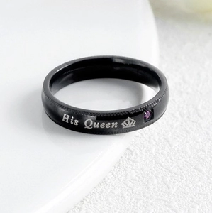Macro detail of black titanium steel His Queen ring featuring crown and purple zircon
