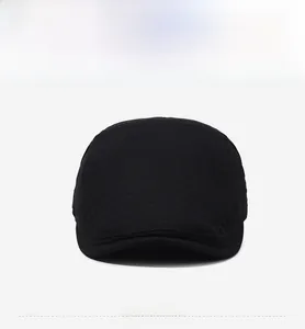 Detailed front view of black mesh flat cap with fine knit texture and short brim