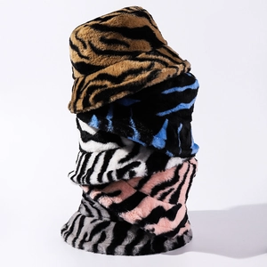 Plush faux fur bucket hats for women featuring stylish zebra and tiger animal prints