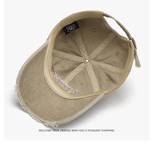 Detail of vintage khaki baseball cap inner structure with embroidery and metal buckle