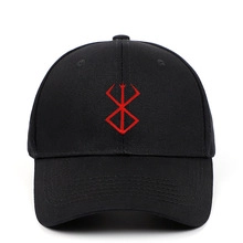 Detail of red embroidered sacrifice symbol on a black anime style baseball cap