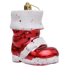 Close-up of glittery red Santa boot Christmas ornament with white snowy texture and gold hook