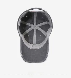 Detailed interior view of vintage washed cotton baseball cap with 100% cotton label