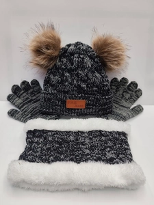 Detail of winter knit set including double pompom hat, warm scarf, and fleece gloves in black grey