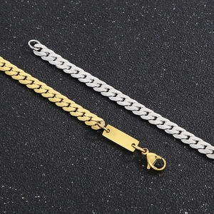 Detail of gold and silver stainless steel flat Cuban link chains with rectangular plate