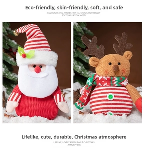 Detail of plush knitted Santa and reindeer dolls featuring festive textures and patterns