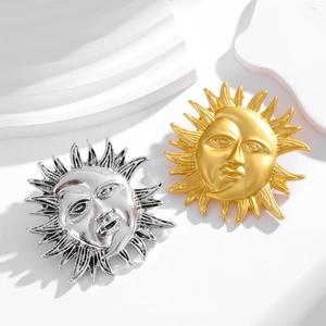 Vintage sun face brooch set in gold and silver finish with textured radiant rays