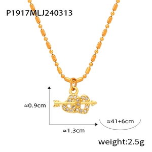 Macro view of gold titanium steel heart and arrow necklace with dimensions and weight