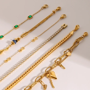 Collection of gold stainless steel bracelets featuring zircon, pearls and green stones