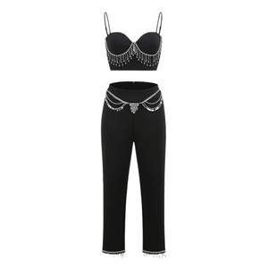 Women's two-piece black knit set featuring rhinestone fringe and metal chain trim