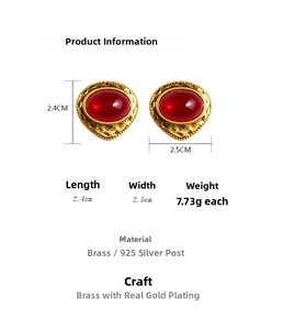 Detailed specs of vintage red stone earrings with gold brass and silver needles