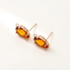 Detail of 14k gold plated stud earring with amber zircon and DIY hanging loop