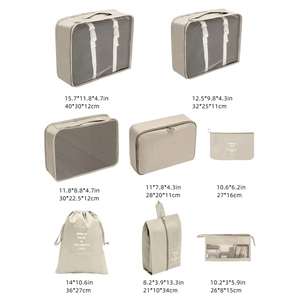 Detail view of 8-piece beige travel organizer set with precise size specifications