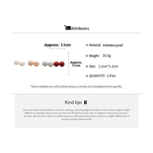 Detail of 1.1cm round pearl stud earrings in white champagne grey and red colors