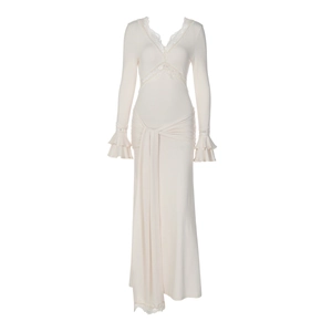 Detailed view of the elegant V-neckline with delicate lace trim and ruffle cuffs