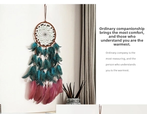 Detailed view of handmade dreamcatcher with natural feathers and colorful wooden beads