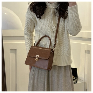 Vintage brown leather crossbody handbag for women with gold clasp and shoulder strap
