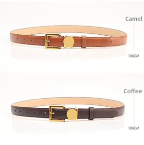 Detail view of camel and coffee brown leather belts with gold metal buckles and stitching