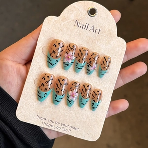 Handmade almond nails with leopard print, 3D floral accents and mint green details