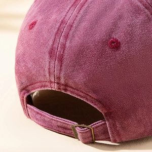 Adjustable burgundy washed cotton baseball cap featuring vintage texture and metal buckle