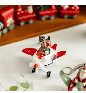 Detail of Christmas reindeer pilot in a red and white propeller plane ornament