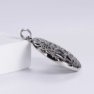 Close-up of a Nordic Viking tree of life hollow pendant made of silver stainless steel