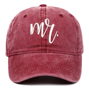Detailed close-up of white 3D Mr. embroidery on vintage washed burgundy baseball cap