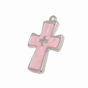 Detailed view of pink enamel cross pendant with silver micro-inlay and metal border