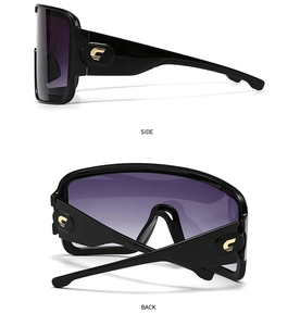 Detail view of side and back profile of oversized mask sunglasses with gold metal logo