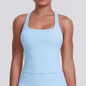 Detailed close-up of light blue athletic racerback tank top with wide straps and square neck