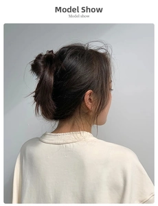 Model wearing a dark brown satin hair scrunchie for a stylish bun hairstyle look