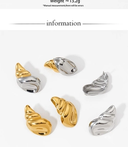 Macro shot of stylish conch shell earrings showing weight and metallic texture