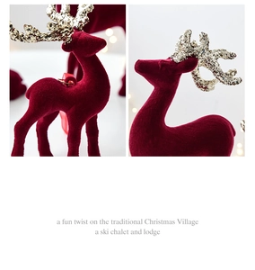Detail of red flocked Christmas reindeer with shimmering gold glitter antlers
